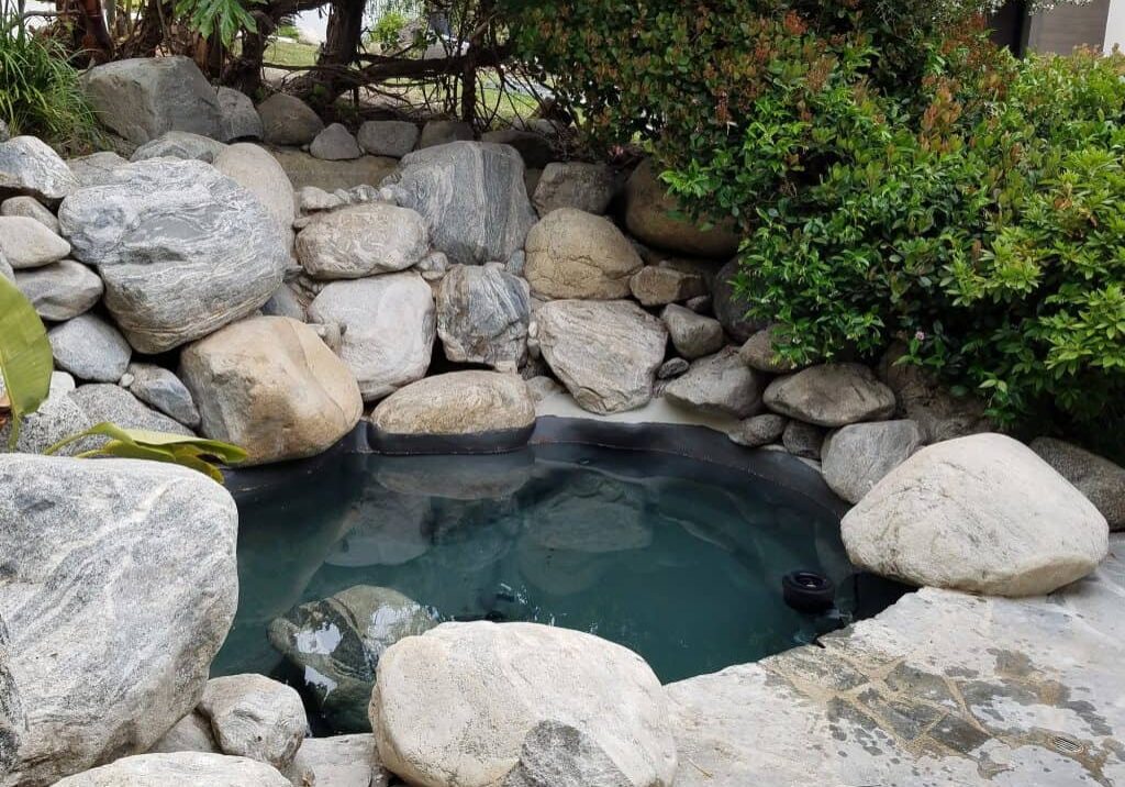 Remodeled Koi pond with very large boulders